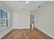 Cozy bedroom with hardwood flooring, fan, and ample natural light at 200 Valdiva St, Punta Gorda, FL 33983