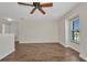 Neutral bedroom with wood floors, a ceiling fan, and a window with outdoor views at 200 Valdiva St, Punta Gorda, FL 33983