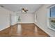 Bright bedroom with wood floors, a ceiling fan, and views from multiple windows at 200 Valdiva St, Punta Gorda, FL 33983