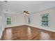 Spacious bedroom featuring wood floors, neutral walls, and an updated ceiling fan at 200 Valdiva St, Punta Gorda, FL 33983