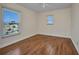 Bedroom with hardwood floors and two windows offering natural light at 200 Valdiva St, Punta Gorda, FL 33983