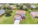 Two-story home with a well-maintained lawn, landscaping, and an attached two-car garage at 200 Valdiva St, Punta Gorda, FL 33983