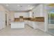 Bright and well-designed kitchen with an island and modern appliances at 200 Valdiva St, Punta Gorda, FL 33983