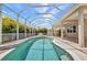 The screened in pool offers a refreshing escape, perfect for entertaining and relaxation at 200 Valdiva St, Punta Gorda, FL 33983