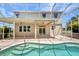 Relaxing screened-in pool with covered patio and ceiling fans offers a refreshing outdoor retreat at 200 Valdiva St, Punta Gorda, FL 33983