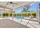 Enclosed in a screen, this pool is surrounded by lush landscaping, perfect for relaxing or entertaining at 200 Valdiva St, Punta Gorda, FL 33983