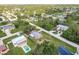 Aerial view of the property highlighting its location within a verdant, established residential area at 20409 Emerald Ave, Port Charlotte, FL 33952
