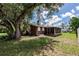 View of the backyard, patio, and surrounding landscape at 20409 Emerald Ave, Port Charlotte, FL 33952