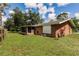 View of the backyard, patio, and surrounding landscape at 20409 Emerald Ave, Port Charlotte, FL 33952
