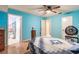 Bedroom with ceiling fan and wood floors at 20409 Emerald Ave, Port Charlotte, FL 33952