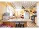 Bright kitchen with breakfast bar, wood floors and modern appliances at 20409 Emerald Ave, Port Charlotte, FL 33952