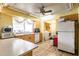 Bright kitchen with breakfast bar, wood floors and stainless steel appliances at 20409 Emerald Ave, Port Charlotte, FL 33952