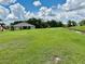 Picture of the large backyard and spacious land with lush green grass perfect for outdoor activities at 214 Castile Ct, Punta Gorda, FL 33983