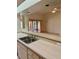 Kitchen counter view with a double sink and tiled floors, ideal for meal preparation and entertaining at 214 Castile Ct, Punta Gorda, FL 33983