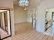 Open living space with tiled floors, recessed lighting, and an open flow into the adjacent kitchen at 214 Castile Ct, Punta Gorda, FL 33983