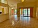 Inviting living room offering seamless access to the screened lanai and views of the private pool area at 214 Castile Ct, Punta Gorda, FL 33983