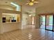 Bright living room with skylights, tiled floors, an open bar, and a clear view of the kitchen at 214 Castile Ct, Punta Gorda, FL 33983
