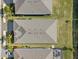 Aerial view of home showing the roof, lawn, and landscaping of the property at 2161 Gardenia Ave, Port Charlotte, FL 33953
