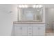 Elegant bathroom featuring double vanity sinks, granite countertops, and a large mirror at 2161 Gardenia Ave, Port Charlotte, FL 33953