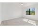 Bright bedroom with a large window allowing ample natural light and a ceiling fan for comfort at 2161 Gardenia Ave, Port Charlotte, FL 33953