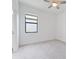 Bright bedroom features a window and doorway to the bathroom at 2161 Gardenia Ave, Port Charlotte, FL 33953