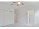 Neutral bedroom boasts closet space and bathroom entrance at 2161 Gardenia Ave, Port Charlotte, FL 33953