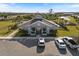 Aerial view of the clubhouse featuring a community gathering space and manicured landscaping at 2161 Gardenia Ave, Port Charlotte, FL 33953