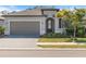 Charming single-story home with a well-manicured lawn, a two car garage and a paved driveway at 2161 Gardenia Ave, Port Charlotte, FL 33953