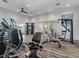 Fitness center equipped with various workout machines, mirror and natural lighting at 2161 Gardenia Ave, Port Charlotte, FL 33953