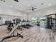 Onsite gym with an array of workout machines, ceiling fan, natural light and neutral color palette at 2161 Gardenia Ave, Port Charlotte, FL 33953