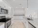 Modern kitchen with stainless steel appliances, granite countertops, and an island with sink at 2161 Gardenia Ave, Port Charlotte, FL 33953