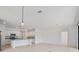 Open-concept kitchen features white cabinets, granite countertops, stainless steel appliances, and a center island at 2161 Gardenia Ave, Port Charlotte, FL 33953