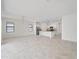 Spacious living room featuring tile floors, neutral walls, and an open layout at 2161 Gardenia Ave, Port Charlotte, FL 33953