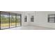 Bright room has big sliding glass doors with a beautiful view of the fenced yard at 2161 Gardenia Ave, Port Charlotte, FL 33953