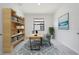 Home office with built in bookshelf and neutral colors at 2161 Gardenia Ave, Port Charlotte, FL 33953