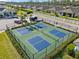 Aerial view of pickleball courts inside a fenced area with multiple courts, perfect for sports enthusiasts at 2161 Gardenia Ave, Port Charlotte, FL 33953