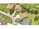 Community aerial view showcasing houses on a long street, pond, and lots of land at 2210 Mauritania Rd, Punta Gorda, FL 33983