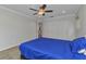 Spacious bedroom with an ensuite bathroom, carpet floors, and double door closet at 2210 Mauritania Rd, Punta Gorda, FL 33983
