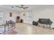 Bonus room with neutral tile floor, ceiling fan, natural light, and pet play area at 2210 Mauritania Rd, Punta Gorda, FL 33983