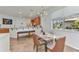 Inviting dining area featuring modern lighting, a view of backyard, and a breakfast bar at 2210 Mauritania Rd, Punta Gorda, FL 33983