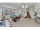 Spacious living room with pool table and foosball table, next to the front entry and stairs at 2210 Mauritania Rd, Punta Gorda, FL 33983
