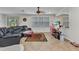 Cozy living room with a large leather sectional, TV, and bright windows with plenty of light at 2210 Mauritania Rd, Punta Gorda, FL 33983