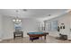 Living room with a pool table, natural light, and neutral tones at 2210 Mauritania Rd, Punta Gorda, FL 33983