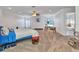 Large main bedroom featuring carpet floors, a ceiling fan, and a bathroom at 2210 Mauritania Rd, Punta Gorda, FL 33983