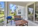 Cozy screened porch with barbecue and outdoor seating, ideal for relaxing and entertaining at 2210 Mauritania Rd, Punta Gorda, FL 33983