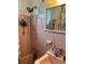Pink tiled bathroom featuring shower and sink with vanity at 22187 Lasalle Rd, Port Charlotte, FL 33952