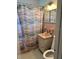 Small pink bathroom featuring a vanity, toilet, and shower at 22187 Lasalle Rd, Port Charlotte, FL 33952