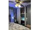 This bedroom features a shelving unit with a fish tank and decor at 22187 Lasalle Rd, Port Charlotte, FL 33952