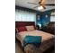 Comfortable bedroom with a ceiling fan, bedside table, and large dresser at 22187 Lasalle Rd, Port Charlotte, FL 33952