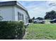 Side exterior view of house with car parked in the driveway at 22187 Lasalle Rd, Port Charlotte, FL 33952